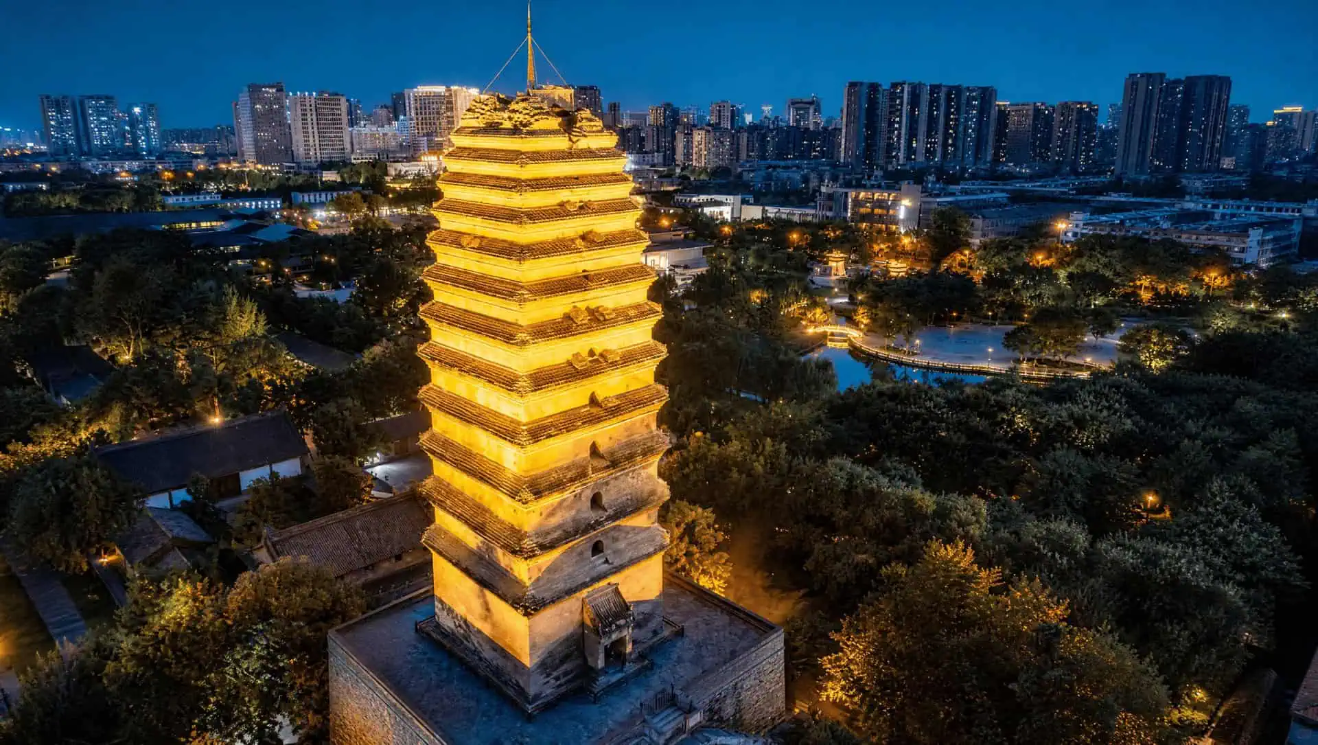 The Small Wild Goose Pagoda, a slender Tang-dynasty brick pagoda rising over courtyard trees in Xi'an