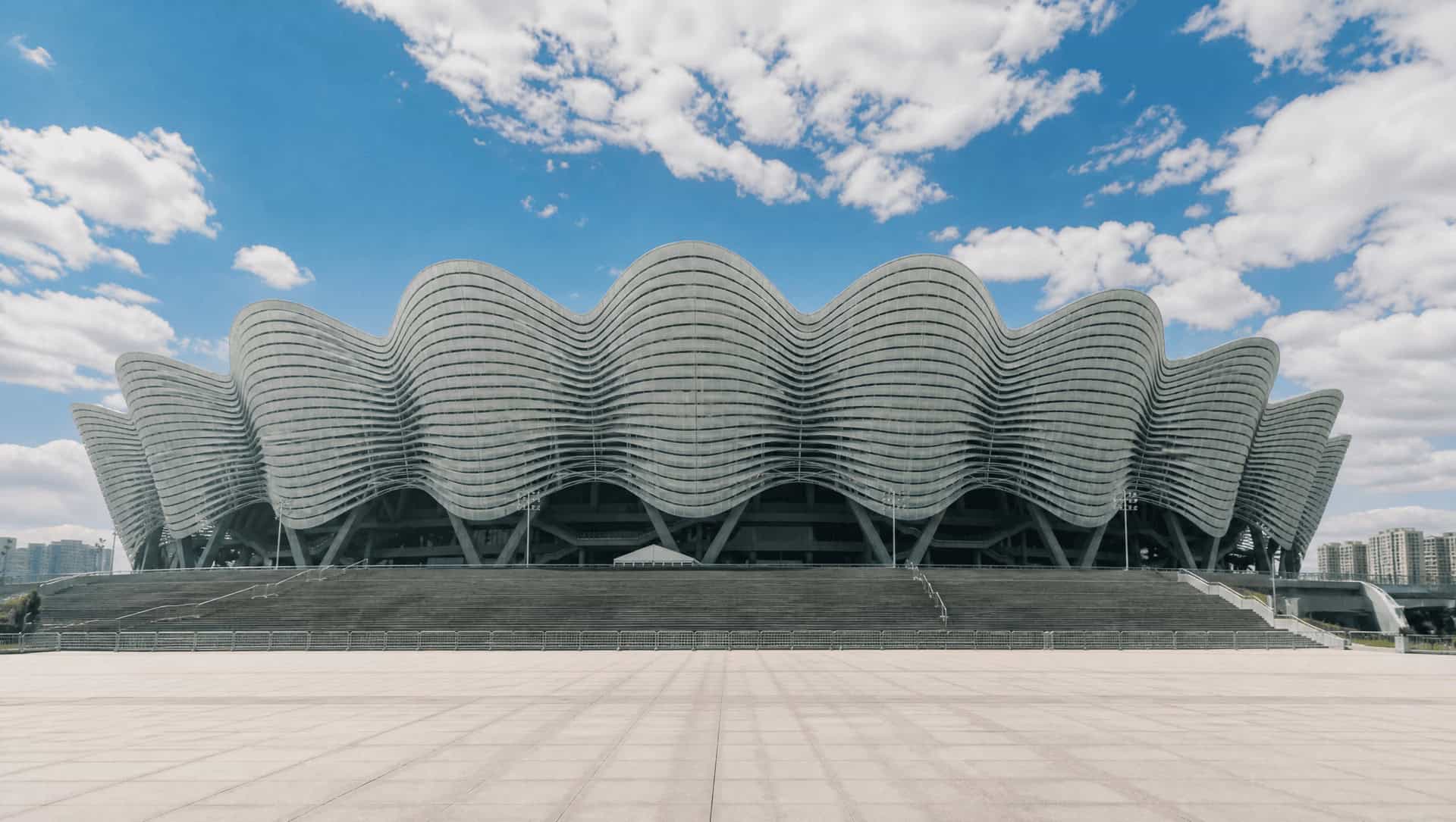 The sweeping ribbed roof of Xi'an Olympic Sports Center stadium